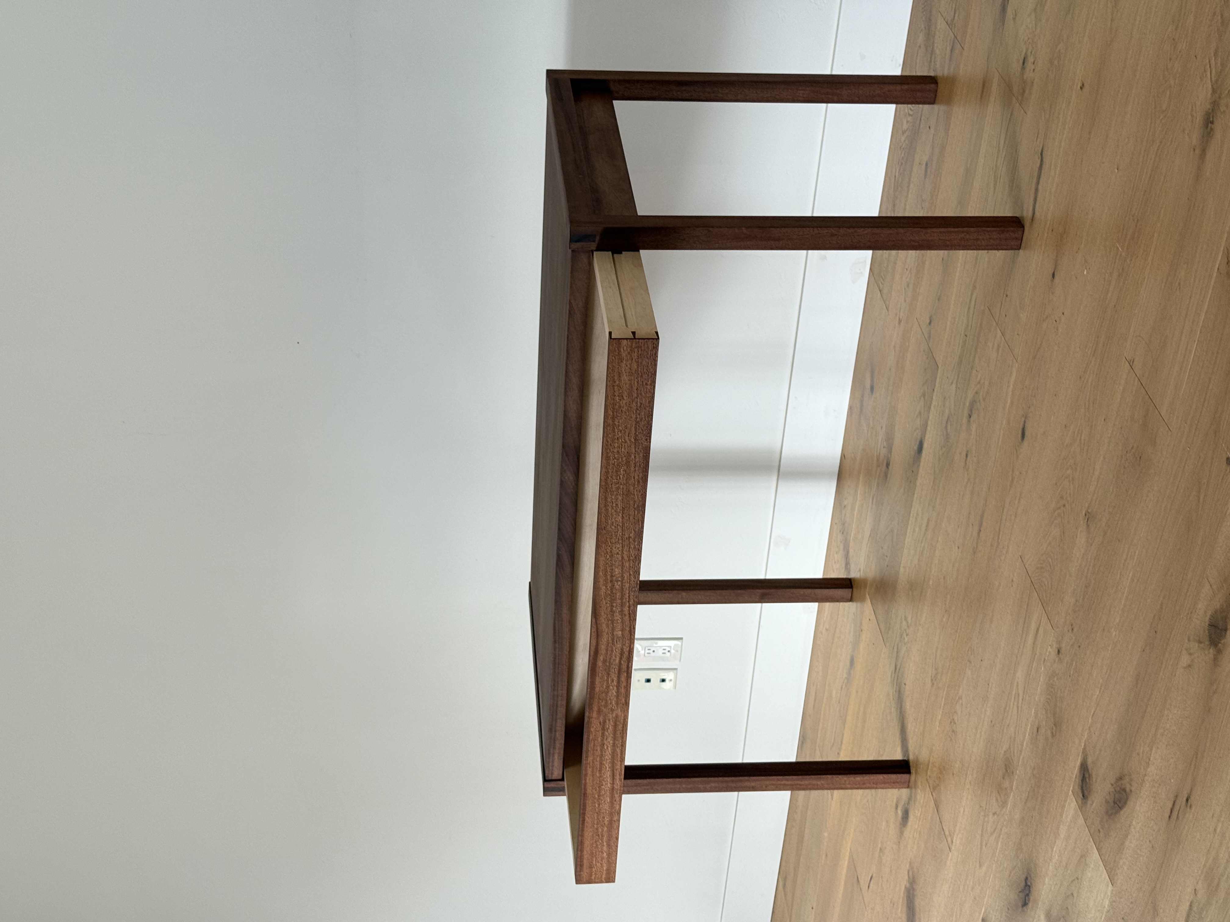 African Mahogany writing desk, front view, with a slim drawer and exposed through-tenon leg joinery
