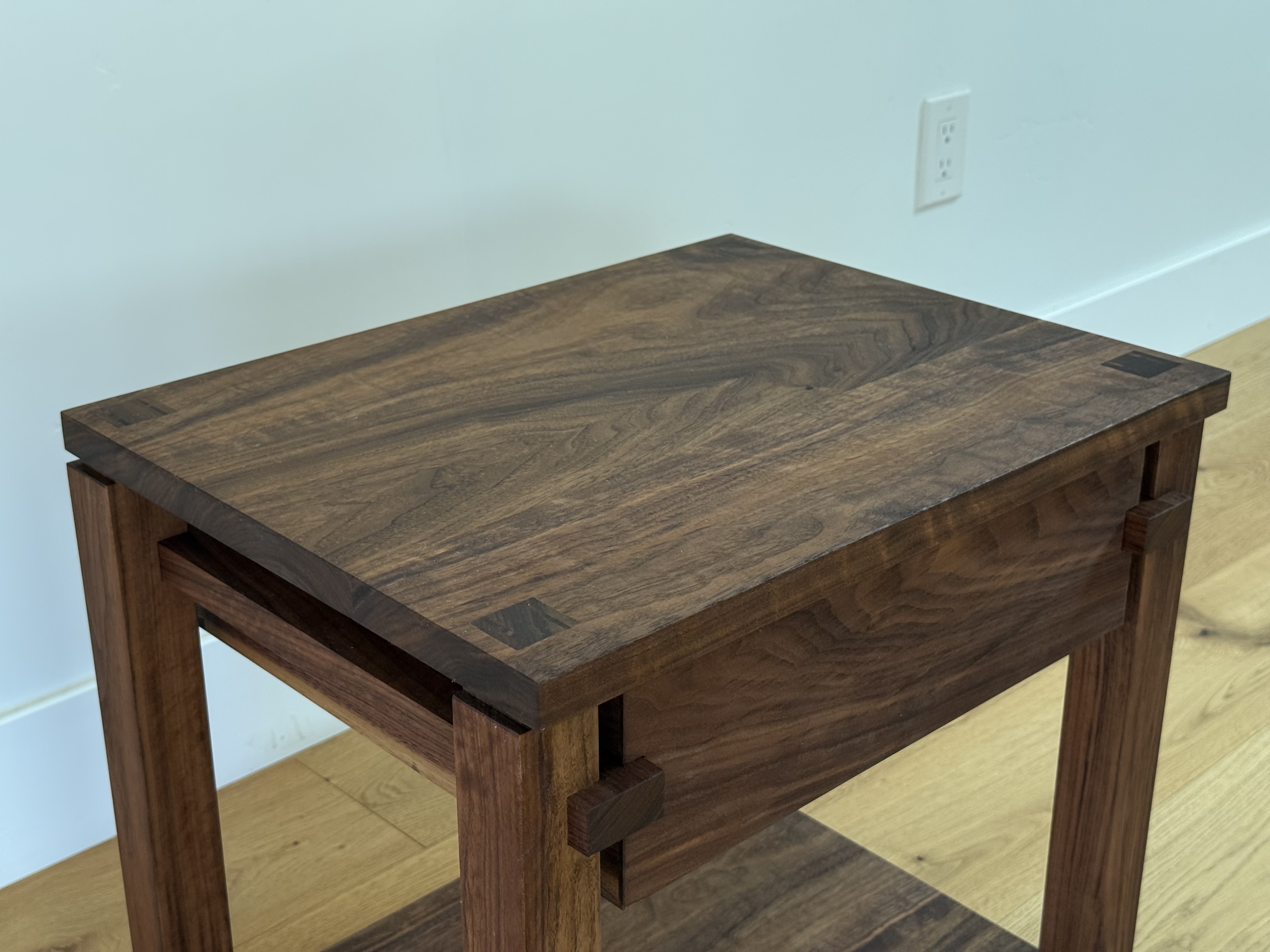 Walnut nightstand, three-quarter view