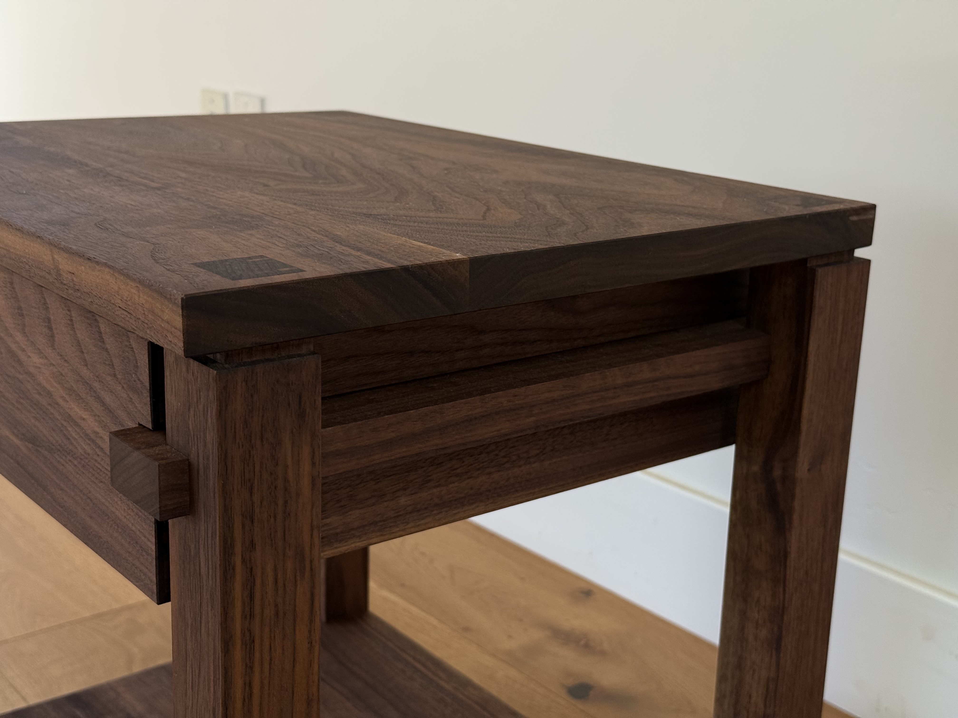 Walnut nightstand drawer detail, hand-cut dovetails