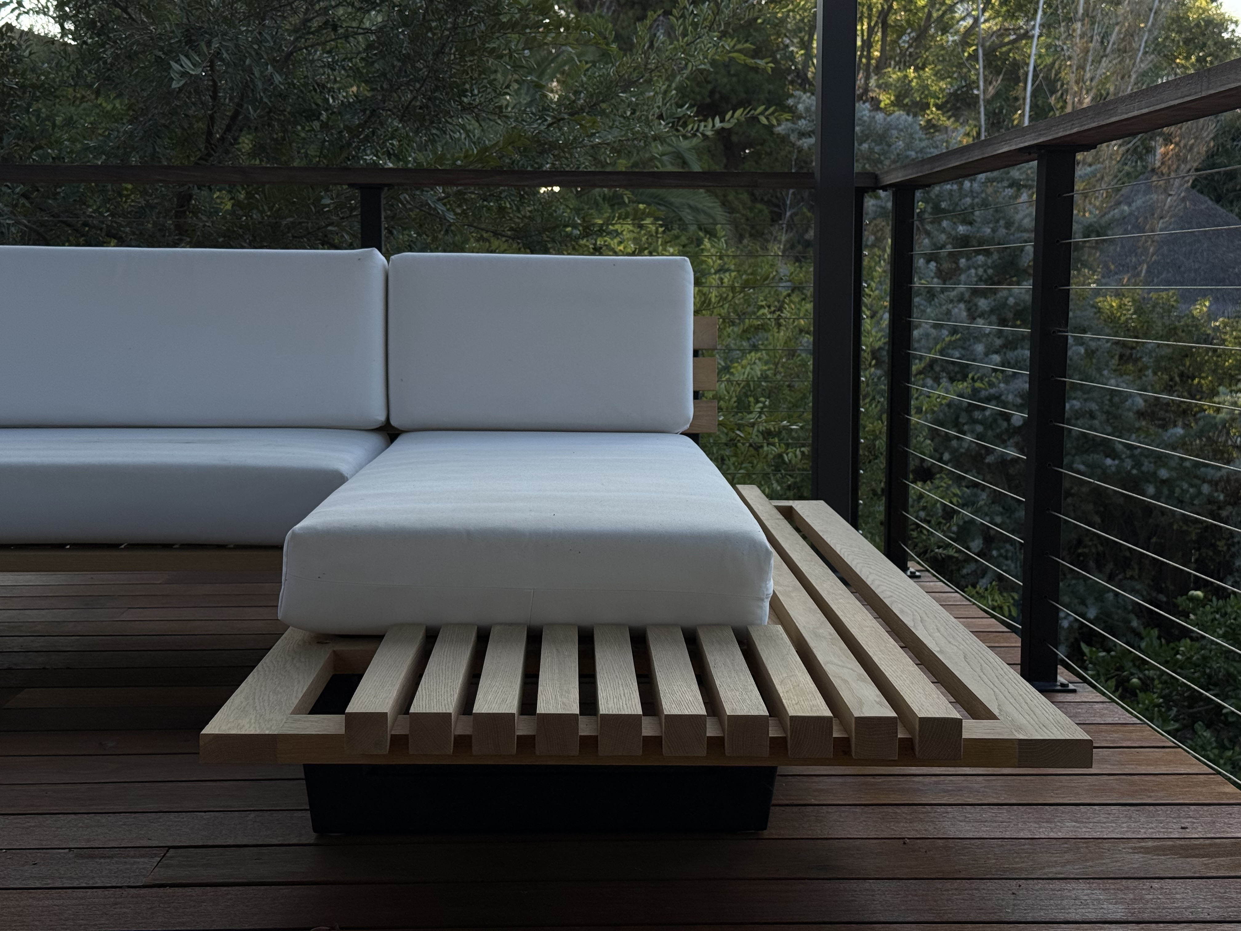 Outdoor sectional sofa detail, hardwood slat frame and cushions