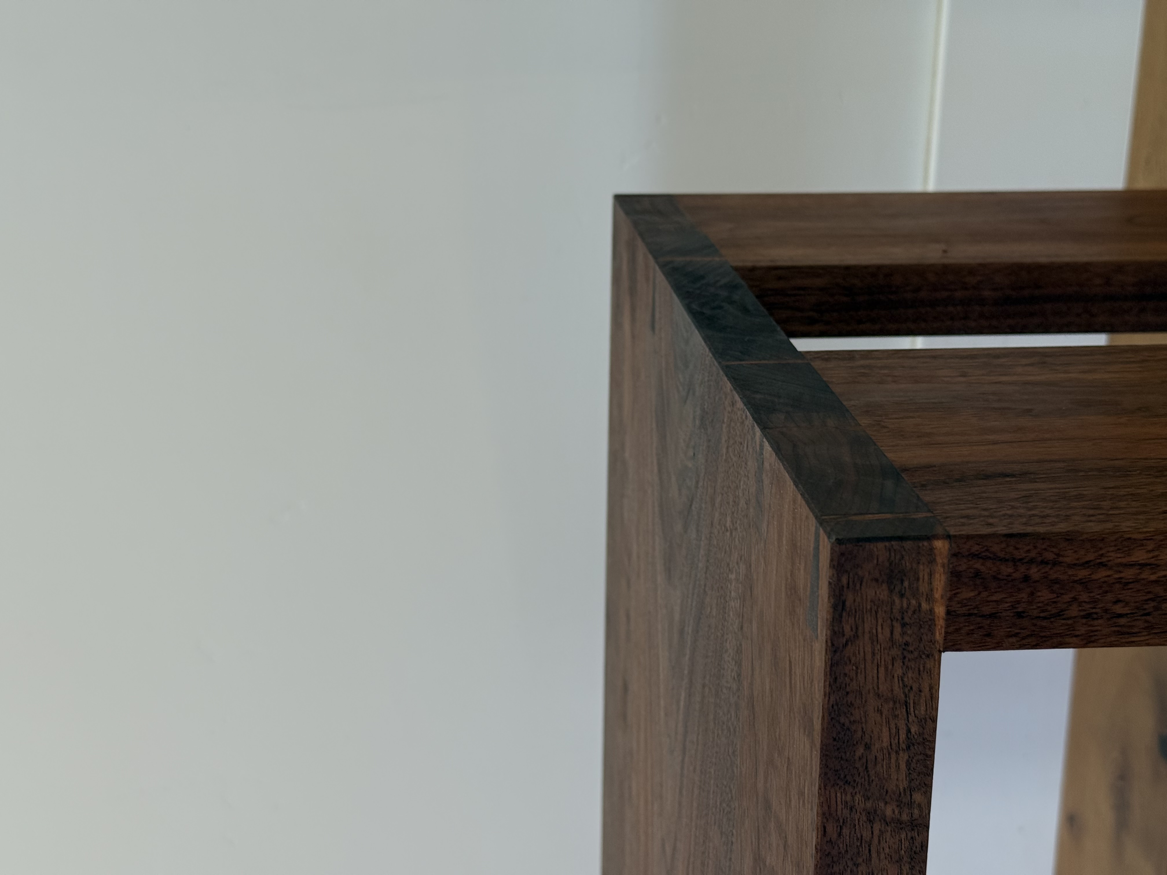 Walnut sofa and side table together in a living room