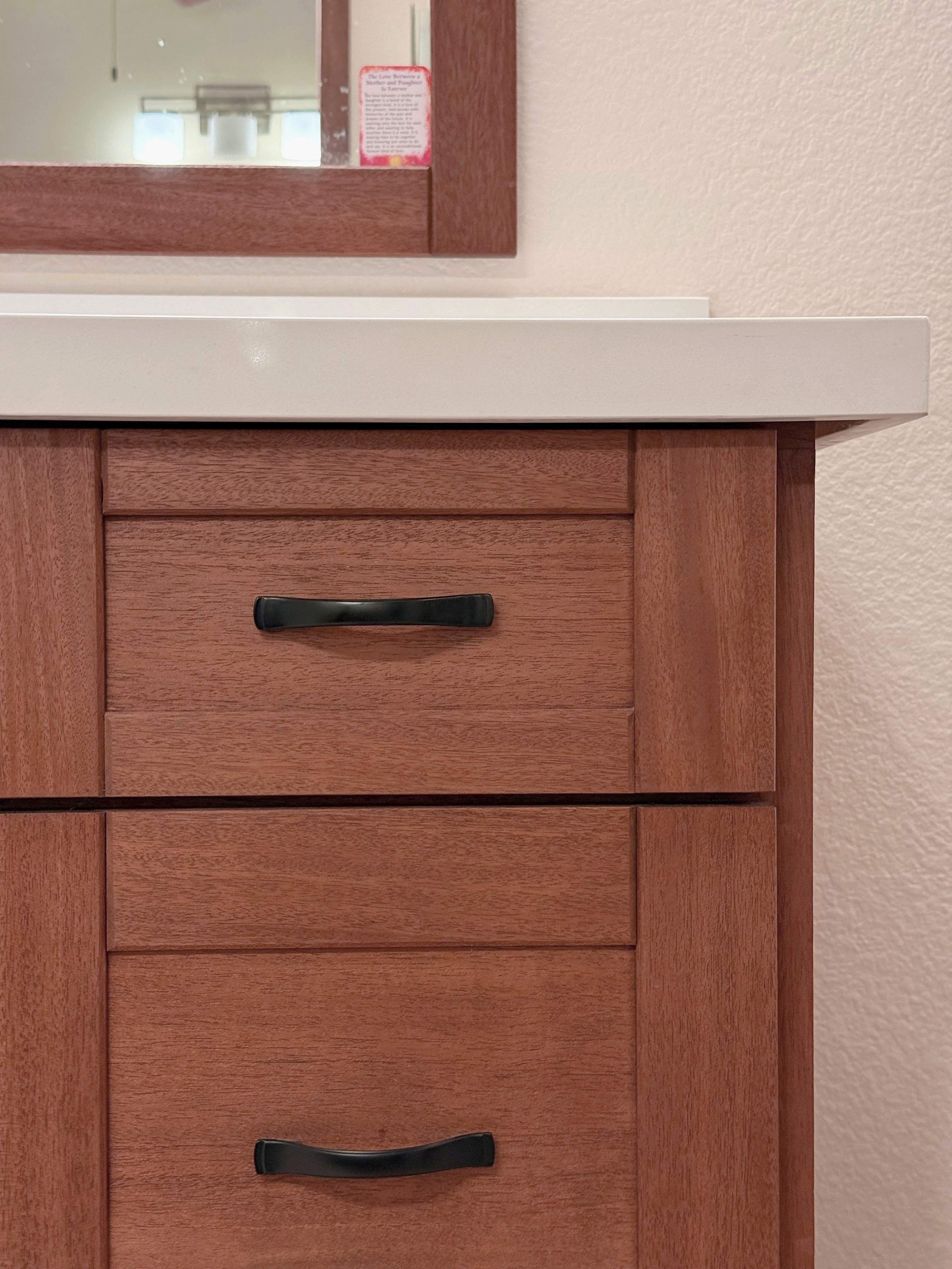 Mahogany vanity door detail, black bail pull hardware
